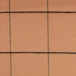 Beiger Stoff mit schwarzem Karomuster auf einer glatten Oberfläche.