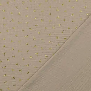 Beige Musselin-Stoff mit goldenen Pusteblumen in gleichmäßigem Muster auf der Oberfläche.