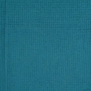 Waffelpique-Stoff in der Farbe Petrol mit einer strukturierten Oberfläche und gleichmäßigen Wabenmustern.